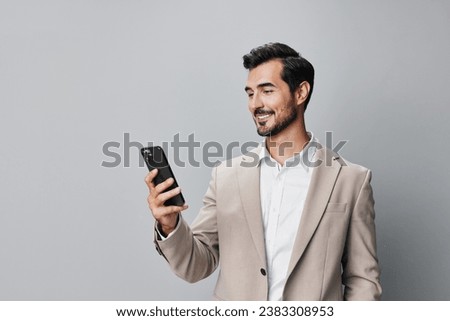 man portrait suit smartphone business call hold phone technology smile happy