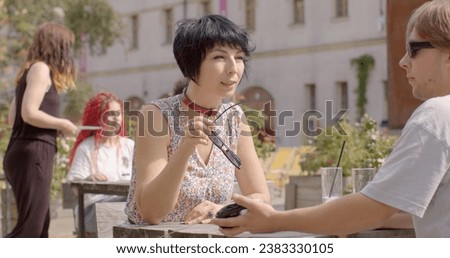 Young woman is actively expressing her opinion, presenting viewpoint with enthusiasm conviction, using persuasive techniques make her case. logical arguments, sharing relevant facts. People lifestyle Royalty-Free Stock Photo #2383330105