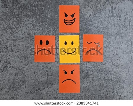 Positive mind attitude. Many office notes with handwriting emoticon face. Multiple face and one that stand out with a smile