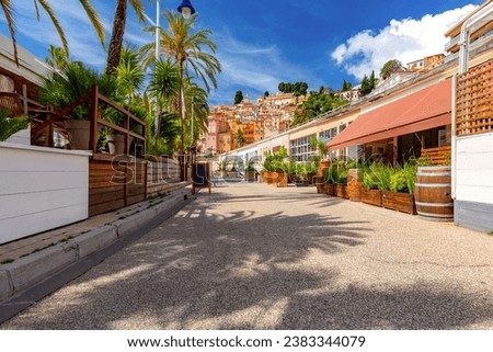 Walking alley along the sea in old part of town of Menton, French Riviera, France