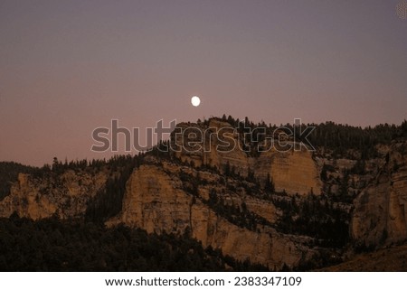 full moon above the mountains in Utah