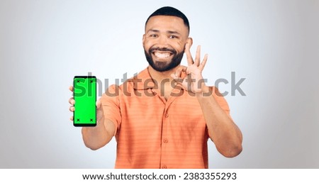 Man, portrait and ok for phone with green screen, space or agreement in studio on white background. Happy model, smartphone or yes emoji for certified newsletter, promotion or advertising information