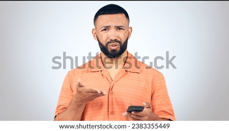 Portrait of man in studio with phone, frustrated and confused with connection problem, 404 or glitch. Communication, anger and person with smartphone with scam, phishing or fraud on white background.