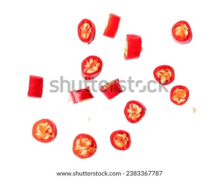 Top view of colorful red chili slices or pieces is isolated on white background with clipping path. Royalty-Free Stock Photo #2383367787