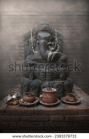 Ganesha statue with incense for prayer Royalty-Free Stock Photo #2383378731