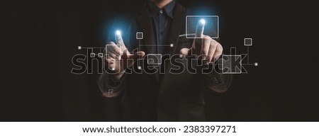 Person with hologram flowchart, businessman designing flowchart business workflow to systematically qualitatively, flowcharting to visualize the workflow of the program. Flowchart design concept. Royalty-Free Stock Photo #2383397271