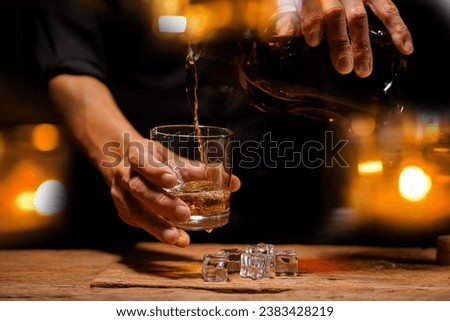 Bartender Serve Whiskey, on wood bar,  Royalty-Free Stock Photo #2383428219
