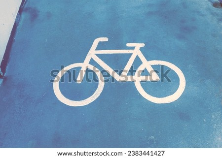 Road sign bicycle path on the road,Traffic sign for exclusive lane for bicycles in the city,bicycle sign on asphalt,Bicycle path, road marking element with graphic bicycle sign,Space for text. Royalty-Free Stock Photo #2383441427