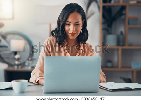 Woman working on laptop online, checking emails and planning on the internet while sitting in an office alone at work. Business woman, corporate professional or manager searching the internet Royalty-Free Stock Photo #2383450117