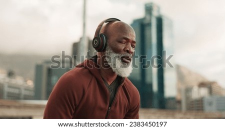 Man, headphones and tired from exercise, city and challenge in outdoor fitness, fatigue and dehydrated. Black mature person, exhausted and workout in retirement, listen and streaming radio or podcast