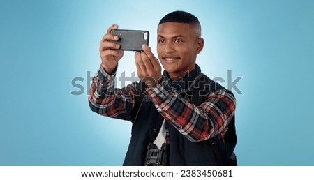 Hiking, man and cellphone with social media, photography and profile picture on a studio background. Person, traveller and model with a smartphone, travel and post with blog, tourism and adventure