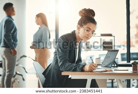 Business, woman and writing notes with laptop, schedule and planning company project in busy marketing agency. Young creative, notebook and ideas of agenda, strategy and working in startup management Royalty-Free Stock Photo #2383451441