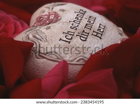 I give you my heart, stone heart with love message on red rose petals heart, love, heartbreak, concept, wedding, marriage proposal, love confession, love symbol, heartbreak