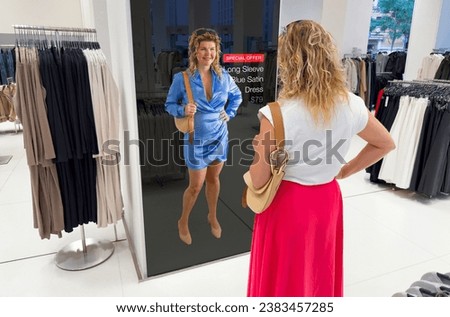 Woman viewing interactive mirror screen in retail store showing personalized offers Royalty-Free Stock Photo #2383457285