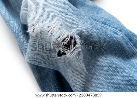 Distressed jeans on a white background