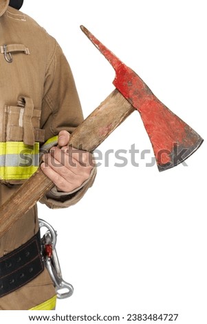 Crop view of anonymous male firefighter in uniform firmly holding red ax. Close up view of shabby pick head axe held by fireman, isolated on white studio background. Concept of job, fire equipment.
