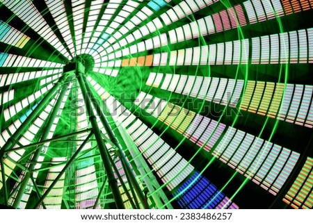 a colorful Ferris wheel at night