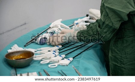 Laparoscopic surgery preparations and supplies. Nurse is preparing equipment for laparoscopic general surgery surgery