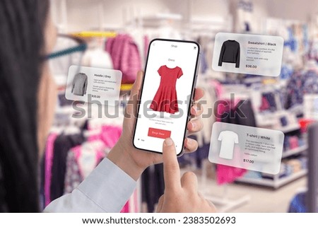 Clothes shop through a smartphone app with balloons arround suggesting clothing recommendations Royalty-Free Stock Photo #2383502693