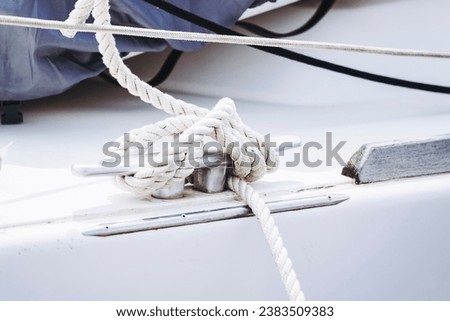 Equipment detail on a sailboat - Rope with marine knot Royalty-Free Stock Photo #2383509383