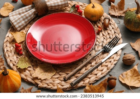 Beautiful table setting for Thanksgiving Day celebration on grey background
