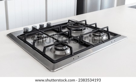 Modern hob gas stove countertop in big kitchen interior. Royalty-Free Stock Photo #2383534193