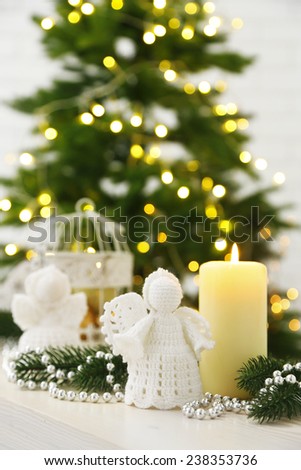 Christmas decorations with candles on fir tree background