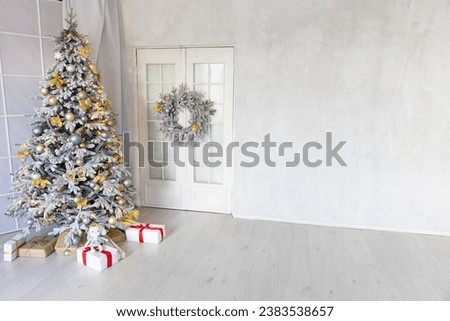 Decorated christmas tree with toys, garlands and gifts for new year