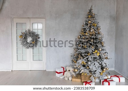 Decorated christmas tree with toys, garlands and gifts for new year