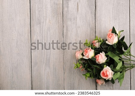 Rose flowers. A bouquet of chrysanthemums, lilies, Tulips.On a wooden background.By the birthday.Valentine's Day background. for weddings.The concept of the holiday.