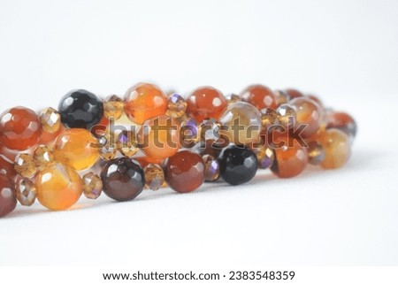 shiny orange and brown jade on a white background