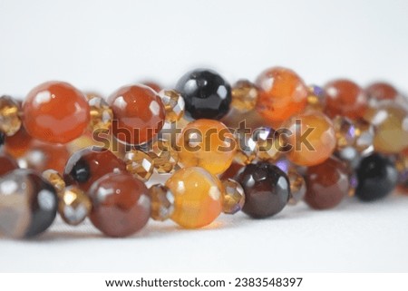 shiny orange and brown jade on a white background