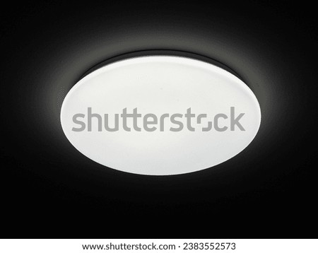 Large circular light bulb in the dark
