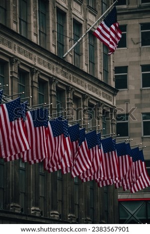 Photo of a bunch of US flags in Rockefeller Center, Manhattan, new York City, United States.