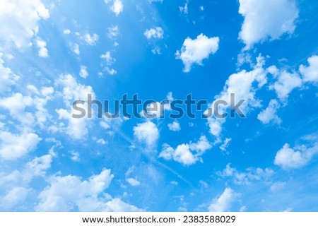 Beautiful blue sky photo with white fleecy clouds, natural background. Abstract panoramic view of cloudy openair atmosphere