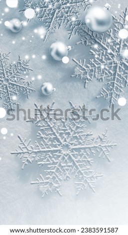 Christmas composition. Snowflakes, balls on white snow background. Christmas, winter, new year concept. Flat lay, top view, copy space