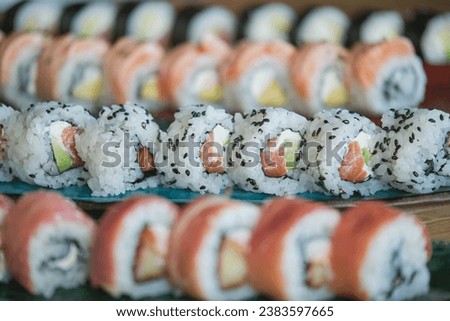 Stock photo of yummy sushi plates in japanese restaurant.