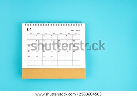 January 2024, Monthly desk calendar for 2024 year on blue color background. Royalty-Free Stock Photo #2383604583