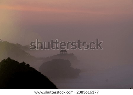 Foggy morning on the beach with sunrise sky - Kukup Beach, Wonosari, Gunung Kidul, Yogyakarta, Indonesia
