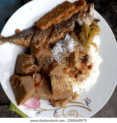 Padang rice with side dishes of fish, tempeh, jackfruit and pumpkin vegetables