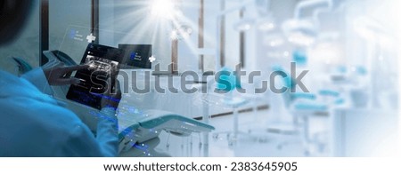 Dentist interacting with patient, use VR computer filling out charts schedule management for treatment with Ai technology for innovate different treatments,dental practices specifically. Royalty-Free Stock Photo #2383645905