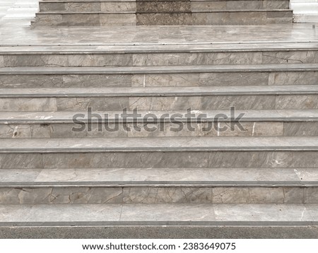 Photographs of various scenes, including tiled floors, grassy surfaces, staircases, and weathered old wooden windows.