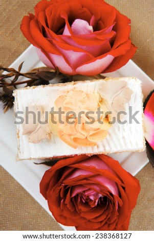 sweet food: tender cream cake served with rose