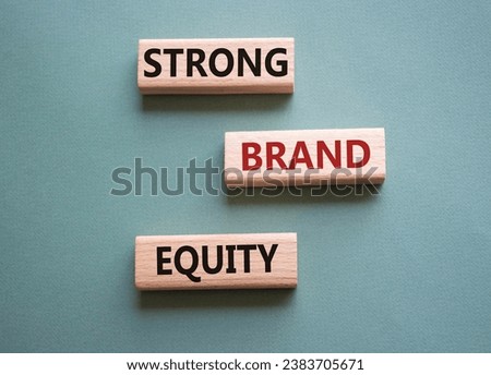 Strong Brand Equity symbol. Concept words Strong Brand Equity on wooden blocks. Beautiful grey green background. Business concept. Copy space