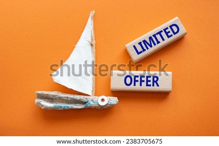 Limited Offer symbol. Concept word Limited Offer on wooden blocks. Beautiful orange background. Business and Limited Offer concept. Copy space