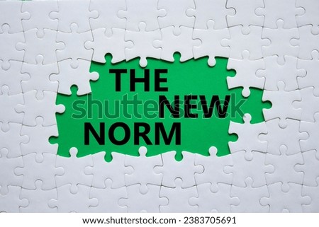 The new norm symbol. Concept words The new norm on white puzzle. Beautiful green background. Business and The new norm concept. Copy space. Royalty-Free Stock Photo #2383705691