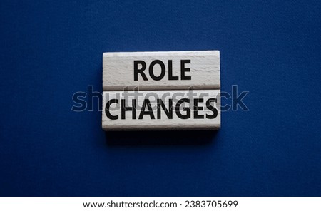 Role changes symbol. Concept words Role changes on wooden blocks. Beautiful deep blue background. Business and Role changes concept. Copy space.