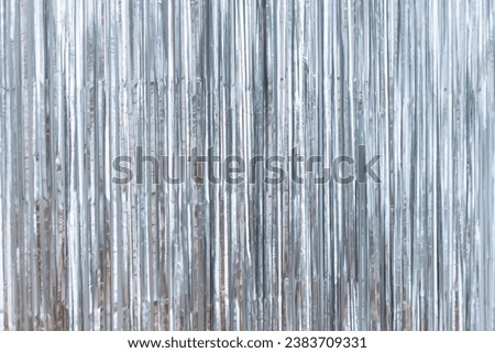 Silver foil glitter tinsel curtain. Shimmer fringe holiday Wedding New Year Christmas decoration. Birthday Party concept
 Royalty-Free Stock Photo #2383709331