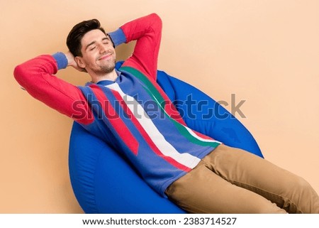 Photo of young satisfied glad person sit bean bag closed eyes businessman hands behind head sleeping isolated on beige color background Royalty-Free Stock Photo #2383714527