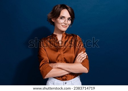 Photo portrait of lovely young lady folded arms confident pose wear trendy brown blouse isolated on dark blue color background